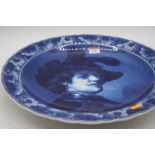 A Delft pottery charger, decorated with a Renaissance style bust of a gentleman, dia. 42cm