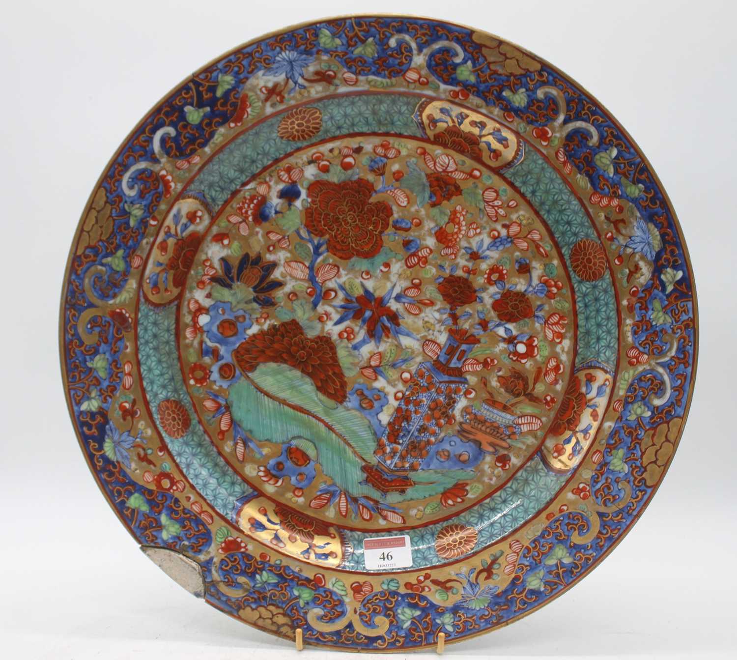 An 18th century Chinese porcelain charger, having later European 'clobbered' decoration, dia. 41cm