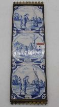 A set of three Delft tin glazed earthenware tiles, each depicting religious scenes, housed within