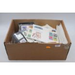 A box of mint stamps & assorted first day covers, to include 250th Anniversary The Birth of Sir
