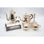 A collection of silver plated wares, to include a pair of a table candlesticks, four-piece tea and