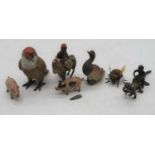 A small collection of various painted figures to include parrot, duck etc