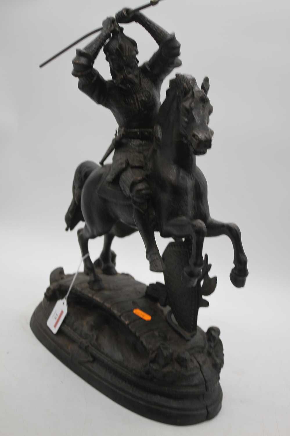A reproduction cast iron figure of a soldier on horseback, shown carrying a spear, height 51cm - Image 2 of 4