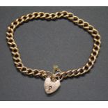 A 9ct gold curblink bracelet, with heart shaped padlock clasp and safety chain, 19.4gHallmarked on