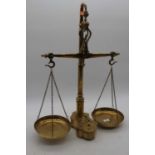 A set of 19th century brass scales and weights, height 56cm