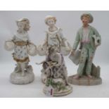 A German porcelain figure of a mother and child, height 23cm; together with three bisque porcelain