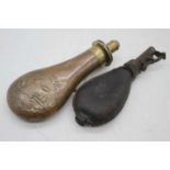 A 19th century brass and copper powder flask, 19cm; together with another
