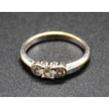 A 9ct white gold diamond three stone ring, sponsor GDL, 2.1g, size K