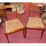 A set of four 19th century mahogany bar back dining chairs, having cane seats (one seat with