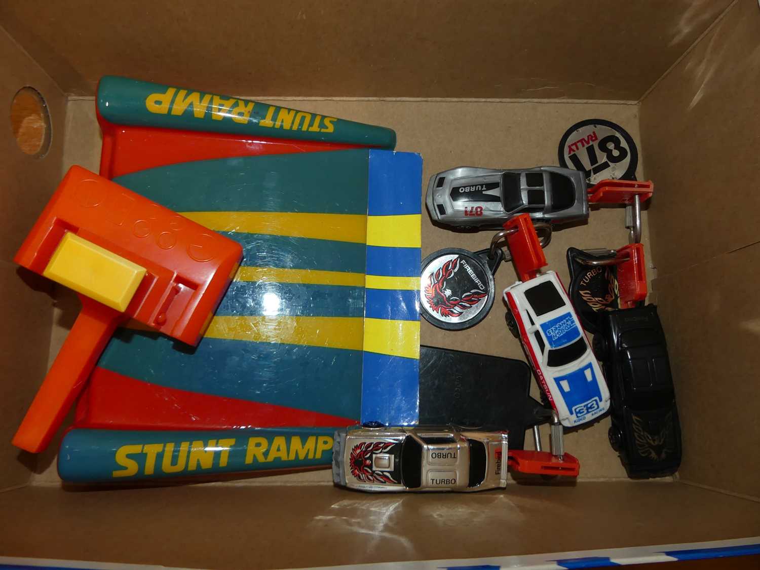 A collection of Kidco 1980s 871 Rally stunt ramp diecast vehicles, key starts and accessories