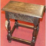 An early 20th century joined and line carved oak joint stool, width 47cm