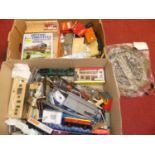 Two large boxes containing a collection of mixed 00 gauge loose rolling stock, lineside accessories,