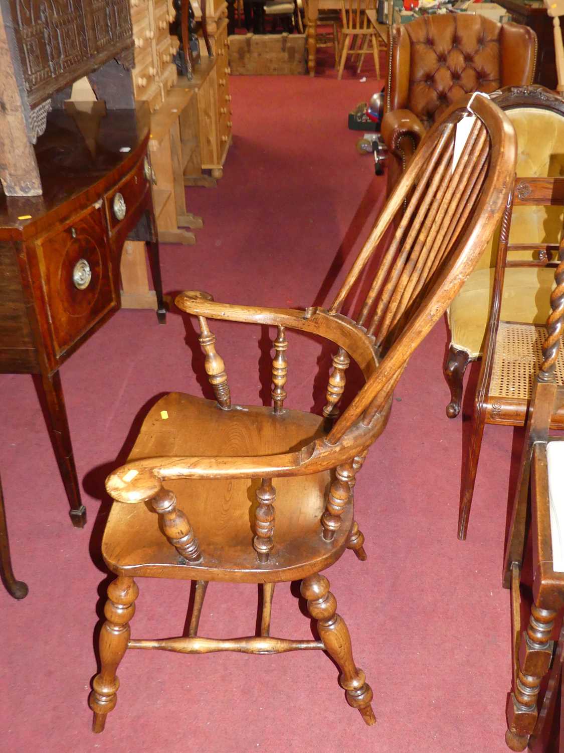 An elm, beech and fruit wood comb back Windsor chair, raised on turned supports to H-stretcher, - Image 5 of 5