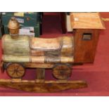 A contemporary stained hardwood child's rocker in the form of a train, length 80cm