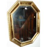 A contemporary giltwood octagonal bevelled wall mirror, 87 x 66cm