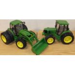 One box containing two large scale John Deere Britains model tractors