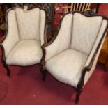 A pair of late Victorian carved mahogany framed and cream needlework fabric upholstered tub