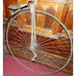 An antique wrought iron framed penny farthing (overall distressed condition and for restoration),