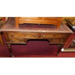 A Victorian mahogany rexine and studded inset kneehole writing table, having an arrangement of