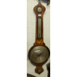 An early 19th century onion topped mahogany four dial wheel barometer, together with a further