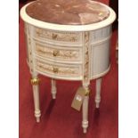 A contemporary French style cream painted rouge marble topped oval three drawer side table, width