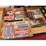 Three boxes of mixed 00 and 0 gauge model trains, lineside accessories and static display