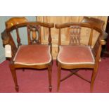 Two similar Edwardian mahogany and satin wood inlaid corner elbow chairs with pink Dralon
