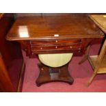 A mid-Victorian mahogany round cornered work table, having pleated silk lower drawer, on