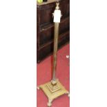 A brass corinthian column standard lamp, on square stepped base, height 124cm