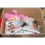 One box of mixed toys, board games etc to include a Dinky Toys Messerschmitt, and a tin plate