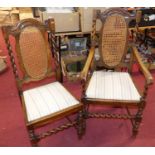 A set of five early 20th century barley twist oak dining chairs, having cane inset backs,