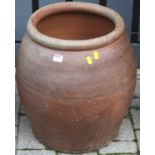 A painted terracotta garden planter of ovoid form, height 49cm