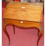 A 19th century French rosewood and floral satin wood inlaid bureau de dame, having a pierced brass