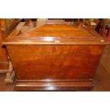 A William IV mahogany sarcophagus-shaped hinge top cellarette, the baize-lined interior fitted for