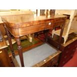 An early 19th century mahogany round cornered fold-over baize lined card table, having rear