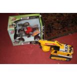 A Zap Toys boxed radio controlled quad bike; together with a Tonka Mighty Motorised Excavator
