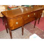 A 19th century mahogany round cornered sideboard having twin long central drawers, flanked by