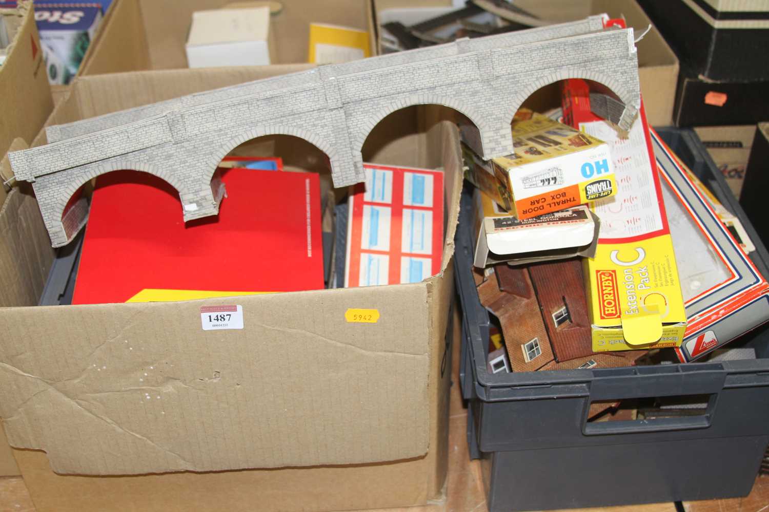 Three boxes containing a quantity of 00 gauge lineside accessories and railway related videos to