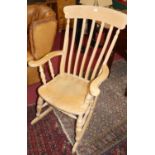 A contemporary beech slat back farmhouse rocking armchair, width 67cm