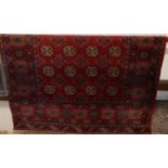 A Persian woollen red ground Bokhara rug, 185 x 139cmSome light fading all over, otherwise no