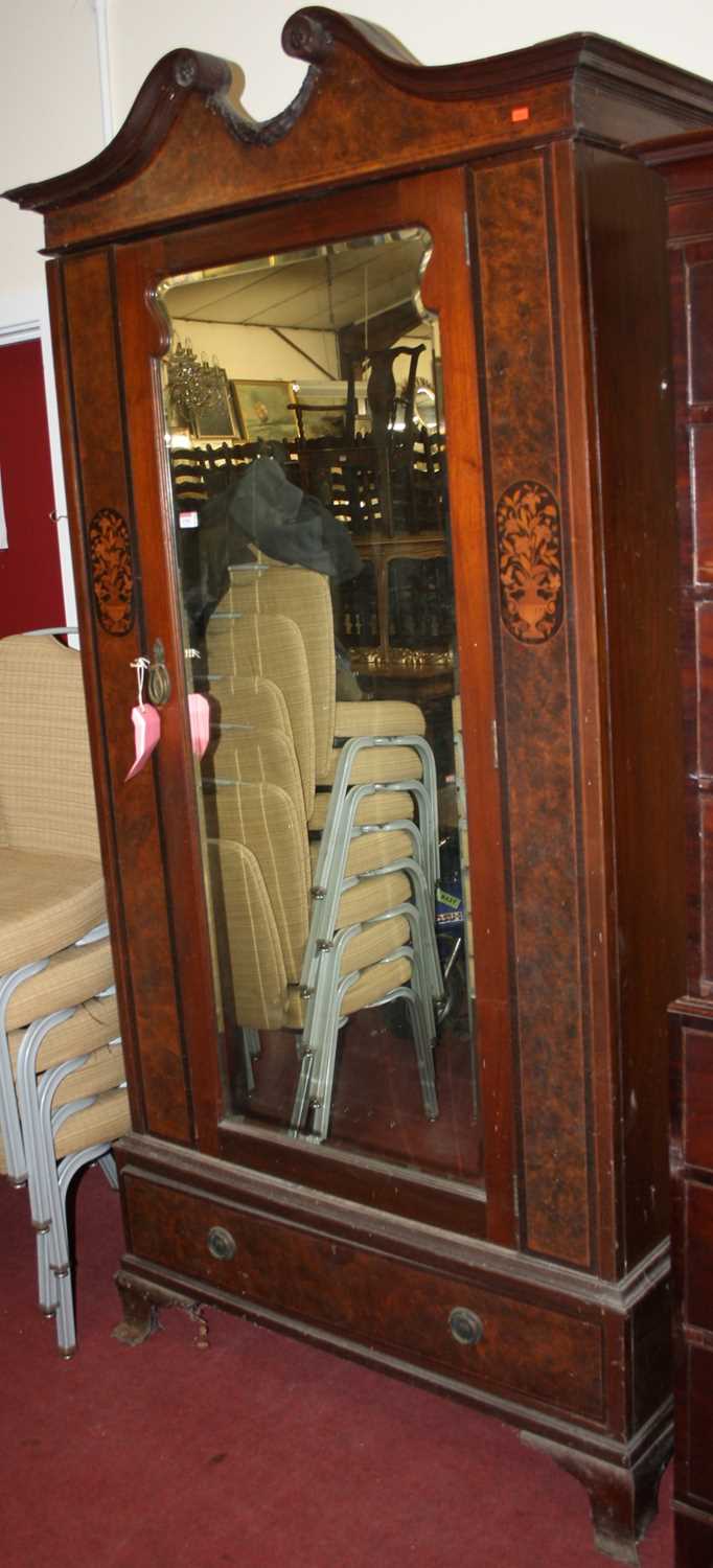 An Edwardian mahogany figured walnut and floral satinwood inlaid single mirror door wardrobe, with