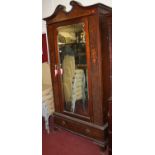 An Edwardian mahogany figured walnut and floral satinwood inlaid single mirror door wardrobe, with