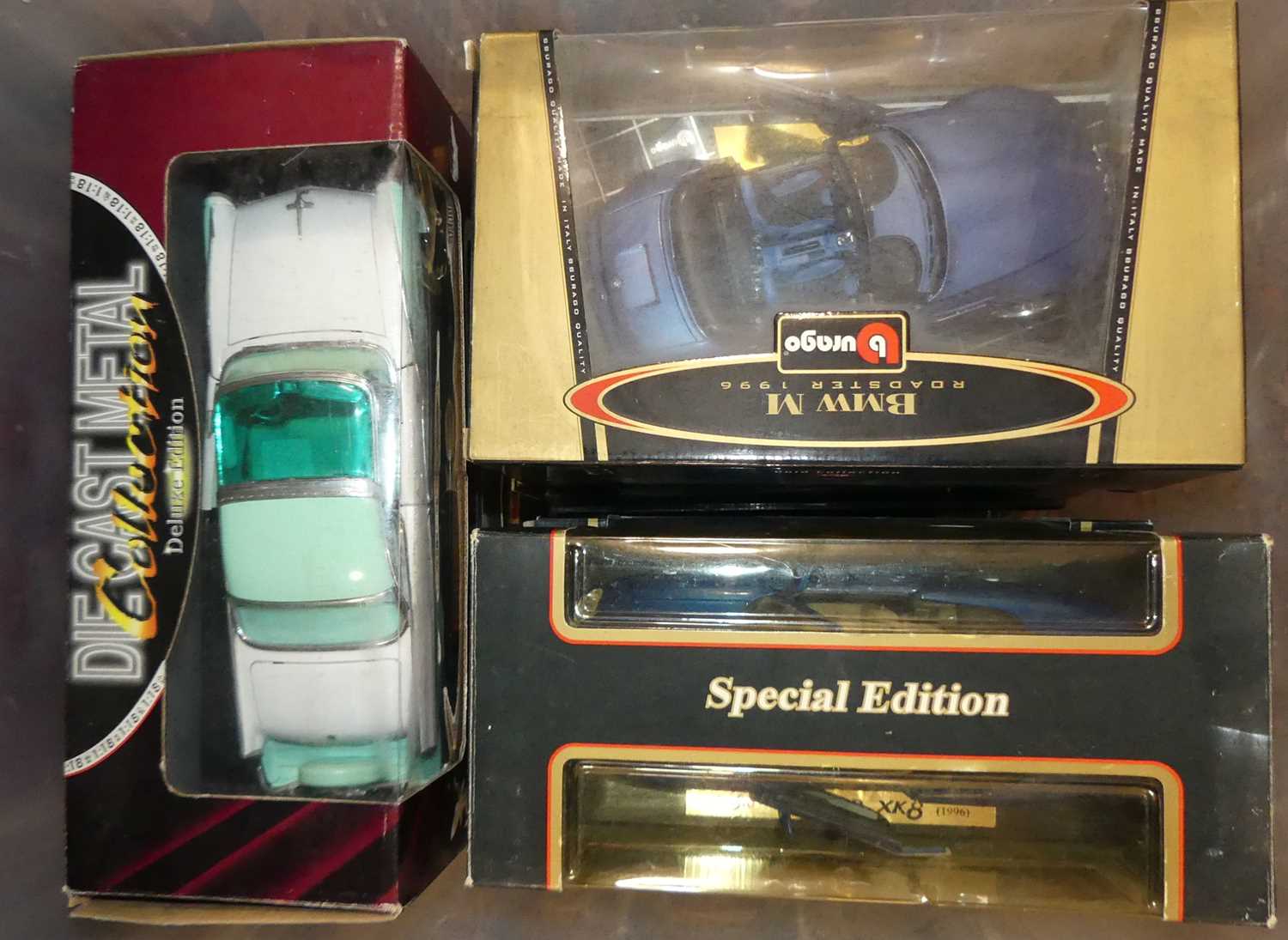 A collection of diecast model vehicles, to include Burago and Maisto