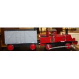 A scratch built and painted model traction engine titled "Brenda", with single goods wagon