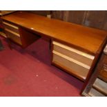 A 1960s teak long kneehole dressing table by Younger, having two flights of twin drawers, width