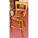 An early 20th century elm seat, beech and fruitwood bar back child's high chair