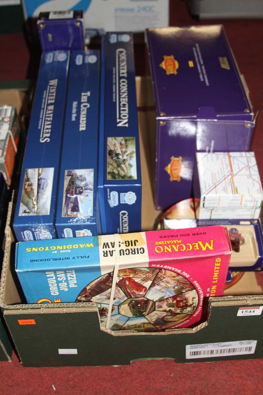 A box of mixed diecast vehicles and puzzles, to include Lledo Showman's Range, Gibson's train