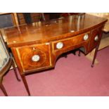 A late 19th century mahogany cross banded and satin wood inlaid bow front sideboard, having three