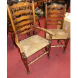 A set of nine elm ladderback rush seat dining chairs (7+2), together with an Edwardian mahogany