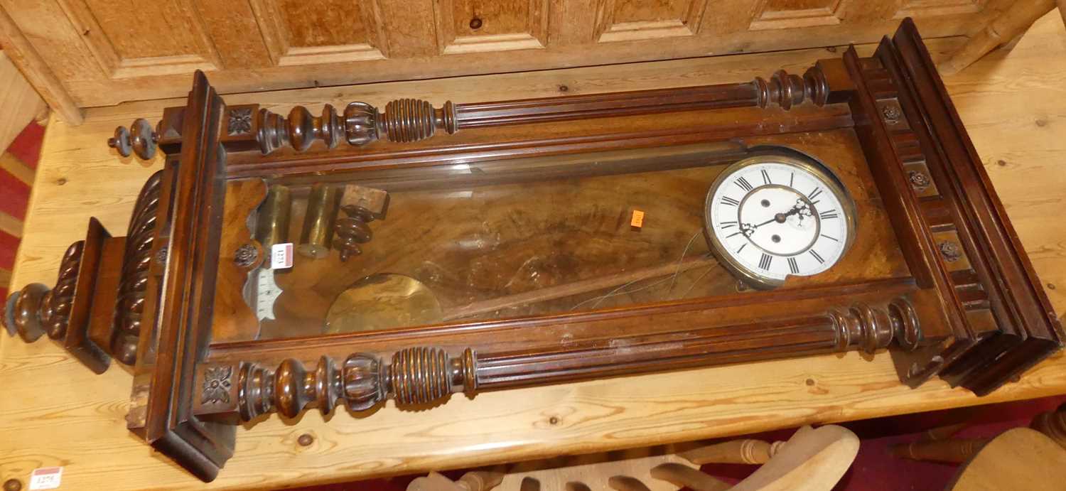 A circa 1900 Vienna walnut regulator clock, with typical glazed trunk door, white enamel dial,